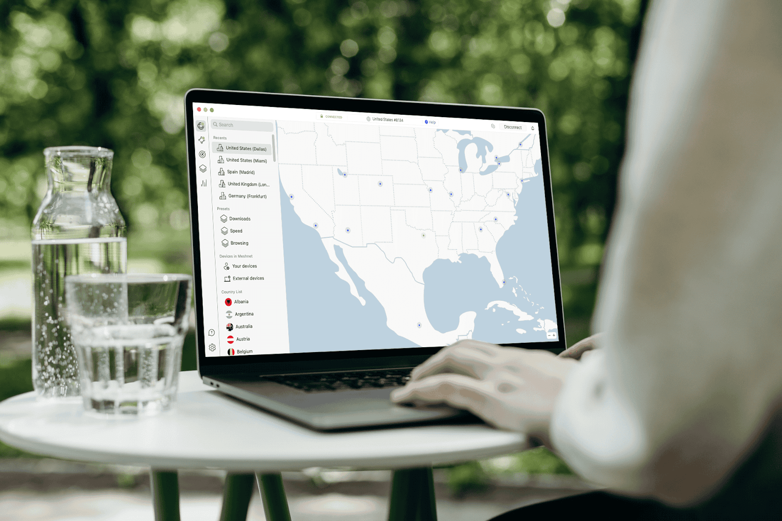 A person on a laptop connecting to NordVPN